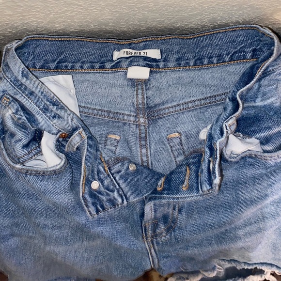 medium-washed ripped mom jeans. - Picture 3 of 4